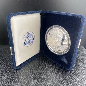 Silver Coin in Blue Display Case